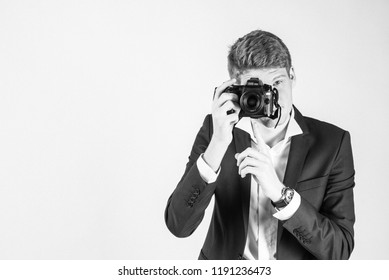 guy on a white background with  a camera 