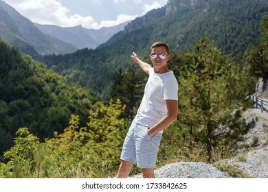 guy pointing to the top of the mountain