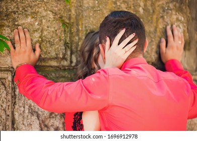 The guy pressed the girl to the wall - Shutterstock ID 1696912978