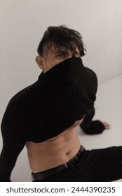 the guy pulled a black sweater over his mouth