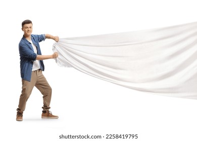 Guy pulling a big white cloth isolated on white background - Shutterstock ID 2258419795