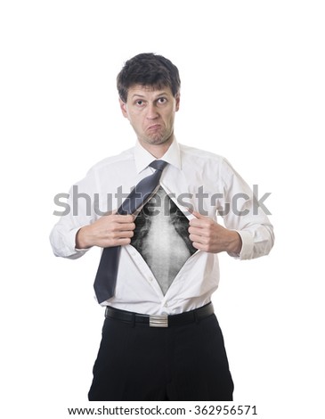 Man pulling ribs apart at a wooden table