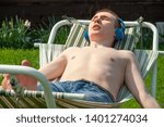 the guy is resting in a hammock