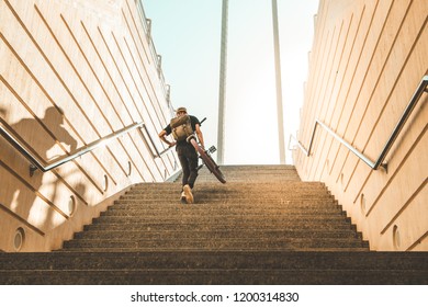 Guy Riding A Bmx Bike Through The Streets Of The City. Guy Going Down Some Stairs With A Bmx Bike.