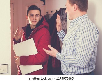 Guy Is Saying Goodbye His Father When Is Leaving To School From The Home.