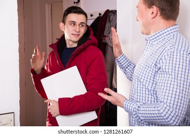 Guy Is Saying Goodbye His Father When Is Leaving To School From The Home.