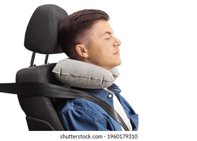 Guy Sleeping In A Car Seat With A Neck Pillow Isolated On White Background