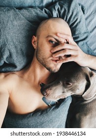 Guy Sleeping With A Dog