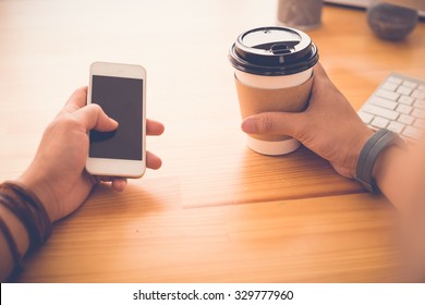 Guy With Smartphone Drinking Take-out Coffee And Checking Out The News Feed, First Person View