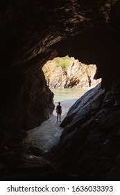 Guy standing in a cave