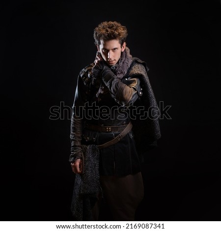 A guy in a steampunk or post-apocalyptic image, portrait on a black background