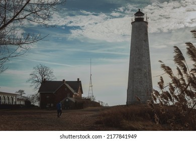 A Guy Taking A Morning Walk Around The Connecticut Lighthouse.