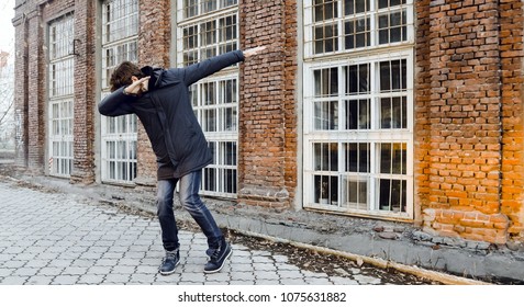 Guy Teen Walking Around The City. Man Do Dance Element Dab On A Street In The City Evening Full Body