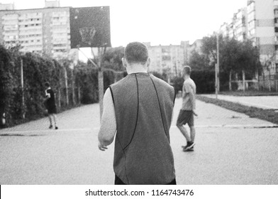 The Guy Turns His Back Into The Camera. Black And White Photo. Retro Vintage Basketball.