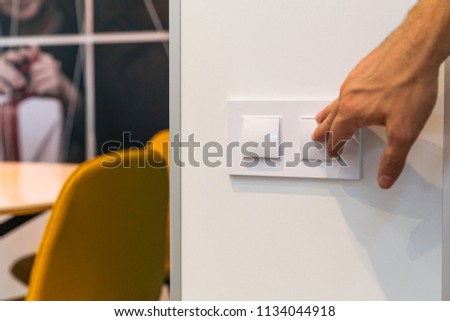 Guy turns off the lights, switch