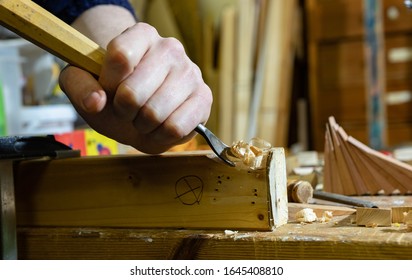 Guy Using A Bent Chisel As Wood Carving Knife.