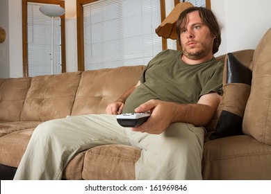 GUy Watching TV With A Big Belly