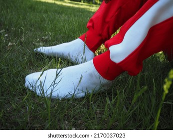 Guy Wearing White Socks And Red Sweat Pants