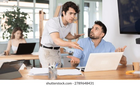 Guy while working at computer gets emotionally abused by boss. Male head of department is dissatisfied with quality of work, is outraged by unsatisfactory competence of employee