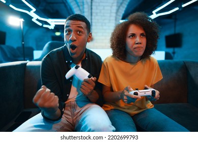 The guy won the game. The friend is upset. High quality photo - Powered by Shutterstock