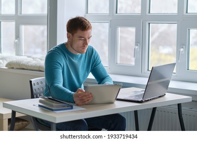 Guy Works From Home. Man Using Laptop, Typing On Keyboard, Writing Email Or Message, Chatting, Shopping, Successful Freelancer Working Online On Computer.