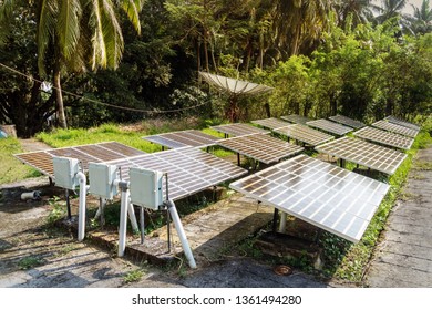 Guyed Cell Tower With Solar Panels Installed On The Ground. Satellite Dish, Satellite Antenna, Satellite Aerial, Satellite Receiver