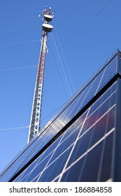 Guyed Cell Tower With Solar Panels Installed On The Ground