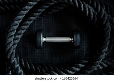 Gym Background With Black Dumbbell And Sport Equipment Workout On Dark Floor Top View