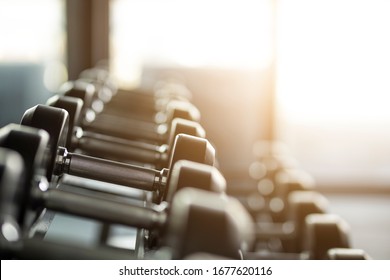Gym background with Fitness equipment dumbbells weight for workout