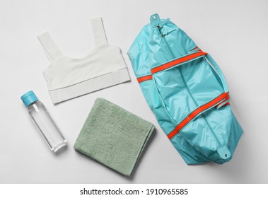 Gym Bag, Yoga Sportswear, Towel And Bottle Of Water On White Background, Flat Lay
