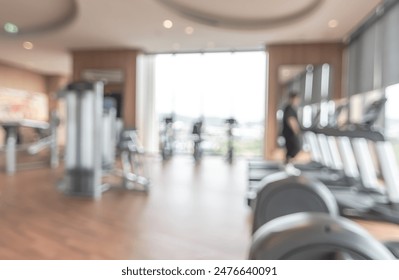 Gym blur background fitness center, workout personal training studio, health club with blurry sports exercise equipment for aerobic, bodybuilding and power strength class - Powered by Shutterstock