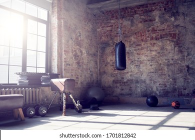 Gym with brick wall with sports equipment