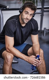 Gym Dude With Headphones And Water, Portrait