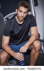 Gym Dude Taking A Break With Water Bottle, Looking Away