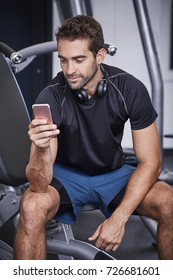 Gym Dude Texting On Smartphone