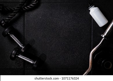 Gym Equipment Cross Dark Background