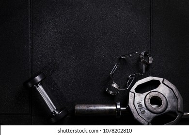 Gym Equipment On Dark Floor Background