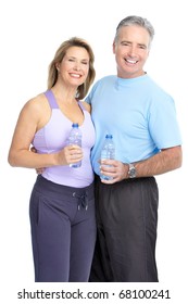 Gym & Fitness. Smiling elderly couple working out. Isolated over white background