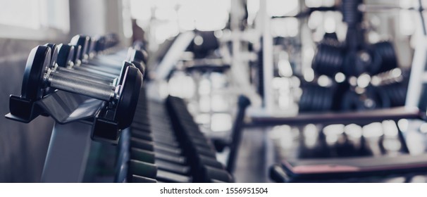 Gym Interior Background Of Dumbbells On Rack In Fitness And Workout Room