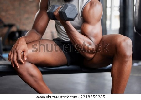 Gym man, exercise and biceps training with dumbell for weightlifting, fitness and bodybuilding at sports center. Power, muscle and guy bodybuilder arm with weights on physical, body and goal workout