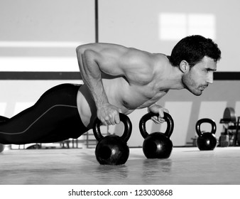 Gym Man Push-up Strength Pushup Exercise With Kettlebell In A Fitness Workout