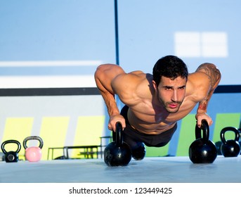 Gym Man Push-up Strength Pushup Exercise With Kettlebell In A Workout