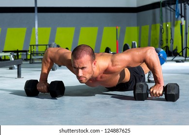 Gym Man Push-up Strength Pushup Exercise With Dumbbell In A Workout