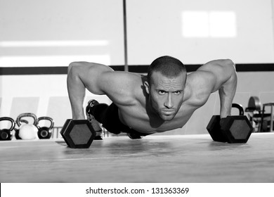 Gym Man Push-up Strength Pushup Exercise With Dumbbell In A Crossfit Workout