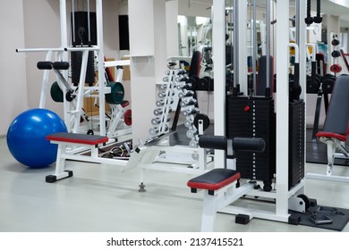 Gym Modern Fitness Center Room. Empty Hall With Simulators On Different Muscles. No People