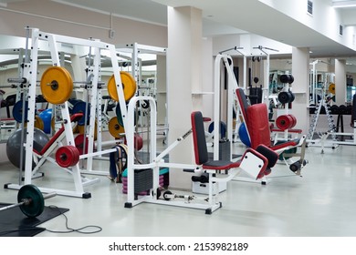 Gym Modern Fitness Center Room. Empty Hall With Simulators On Different Muscles. No People