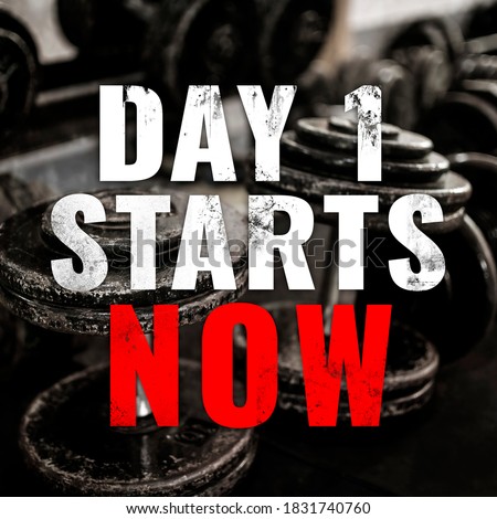 Gym motivational saying - Day 1 starts now - with dumbbell rack as a background. Gym motivation and hype words for beginner or returning athlete or gym rat.