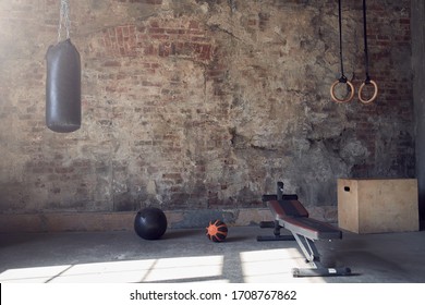 Gym with old brick wall with sports equipment