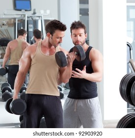 Gym Personal Trainer Man With Weight Training Equipment