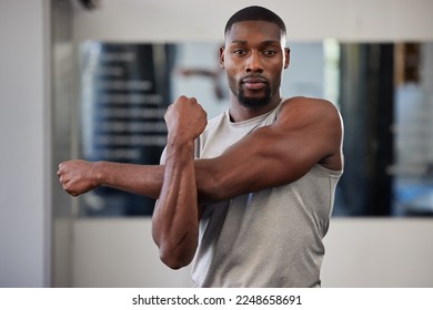 Gym portrait and black man stretching arms for bodybuilder fitness and muscle warm up with focus. Training, wellness and athlete man workout preparation for exercise lifestyle at health club. - Powered by Shutterstock